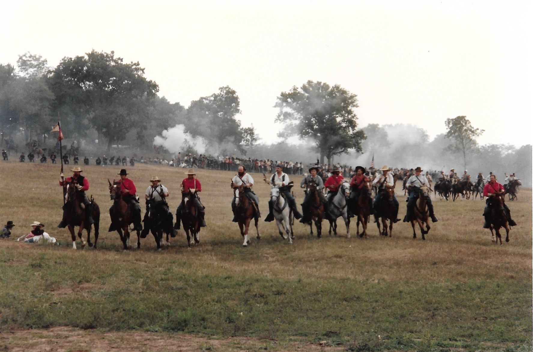 Men on horseback in a field
